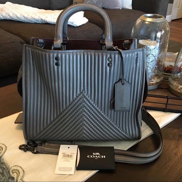 coach rogue with quilting and rivets